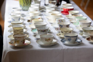Teacups laid out for a Reunion event 