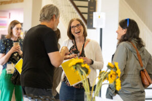 People talking and laughing during Reunion