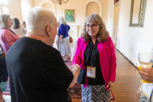 President Sue Ott Rowlands talks with an alum during Reunion