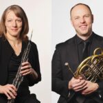 A photo collage of a woman holding an English horn and a man holding a French horn