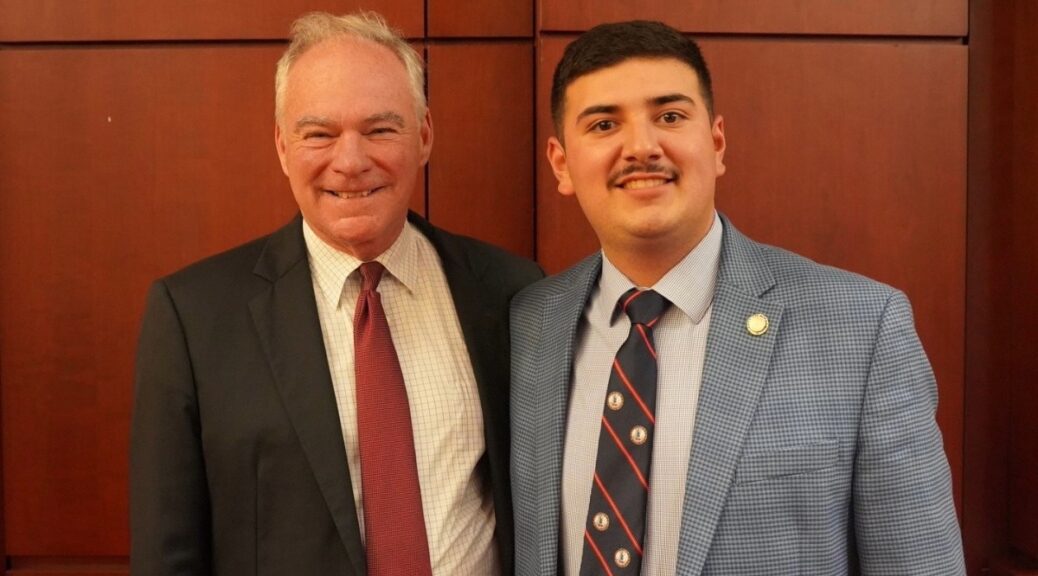 Student intern Cesar Ibarra-Lopez poses for a picture with Virginia Sen. Tim Kaine