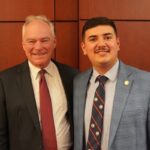 Student intern Cesar Ibarra-Lopez poses for a picture with Virginia Sen. Tim Kaine