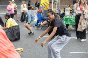 A woman dances during a tailgate event 