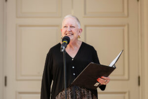 President Sue Ott Rowlands speaks in front of a microphone