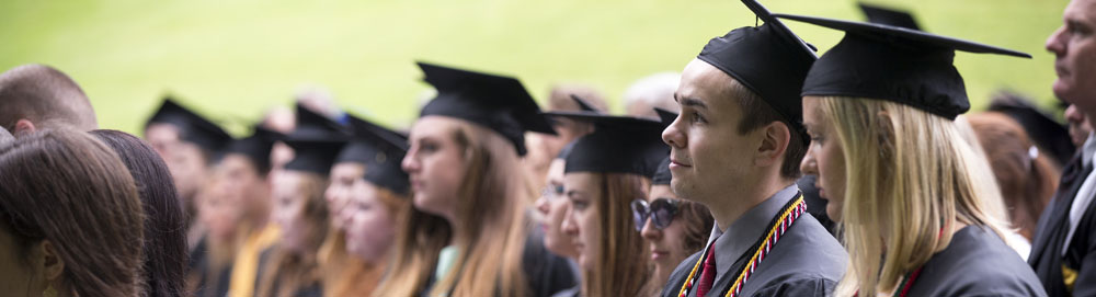 graduates at commencement