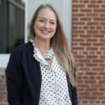 Tiffany Vines ’95 poses for a portrait on the Student Center deck