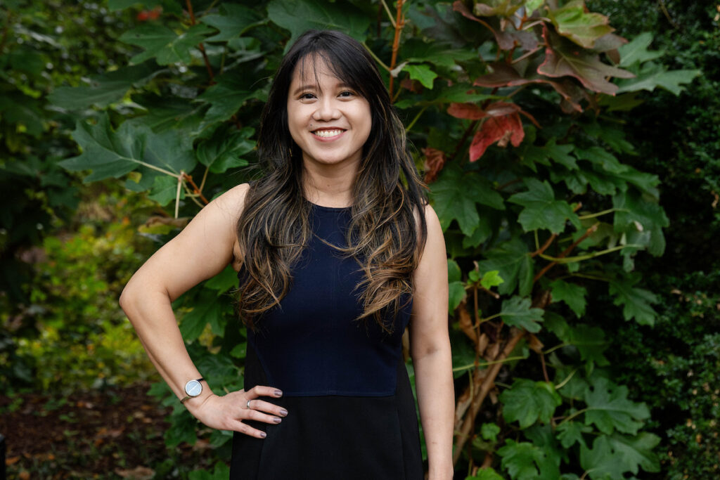 A woman poses in a black dress, with her hand on her hip A woman poses in a black dress, with her hand on her hip
