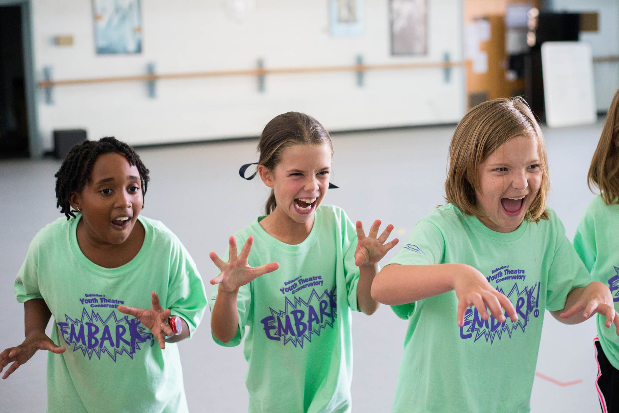 Children practice characters in an Embark acting class.