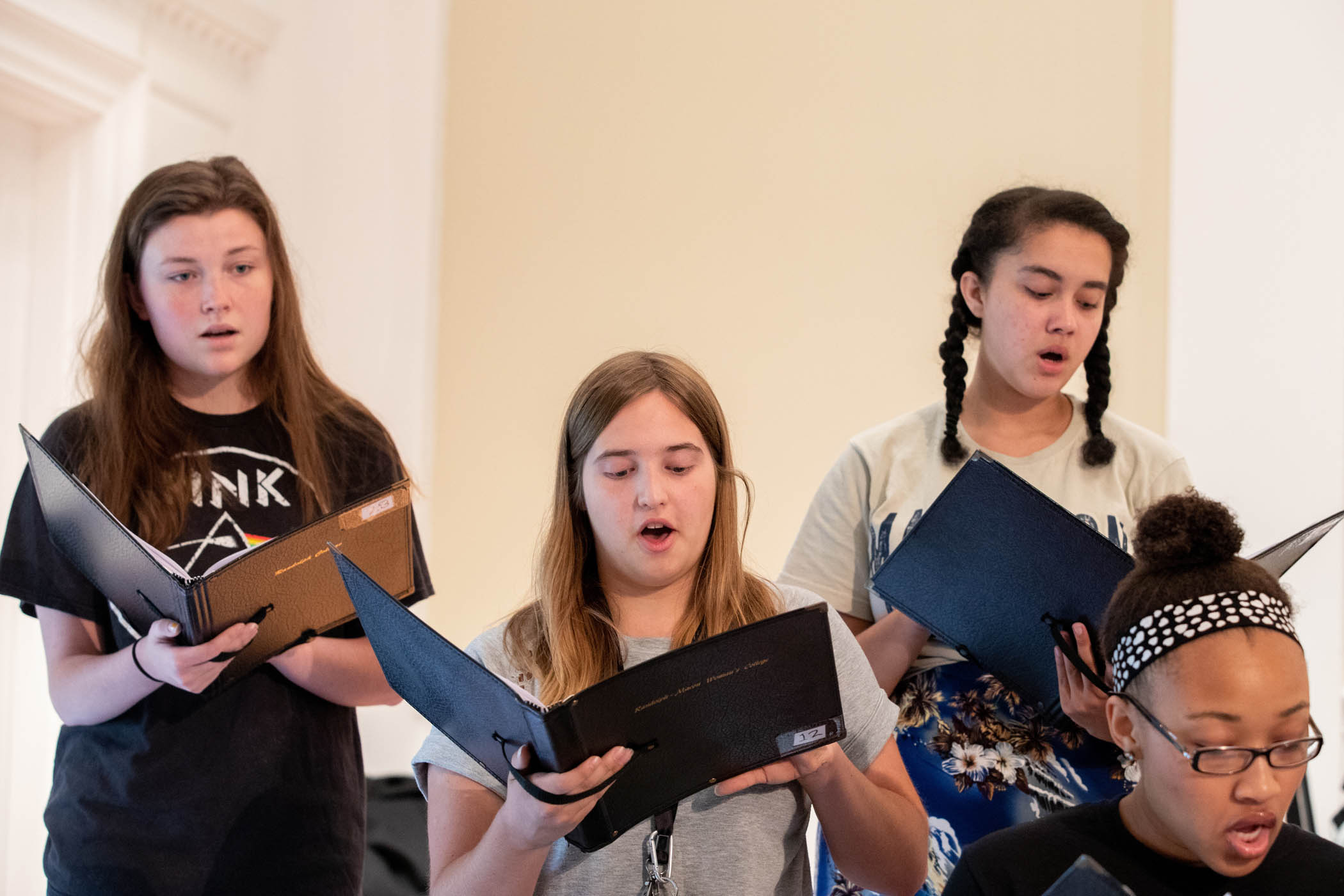 Female singers in chorale rehearsal