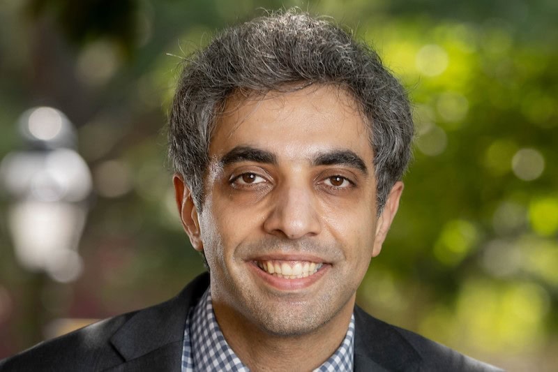 Portrait photo of professor Siavash Sittar outside on front campus