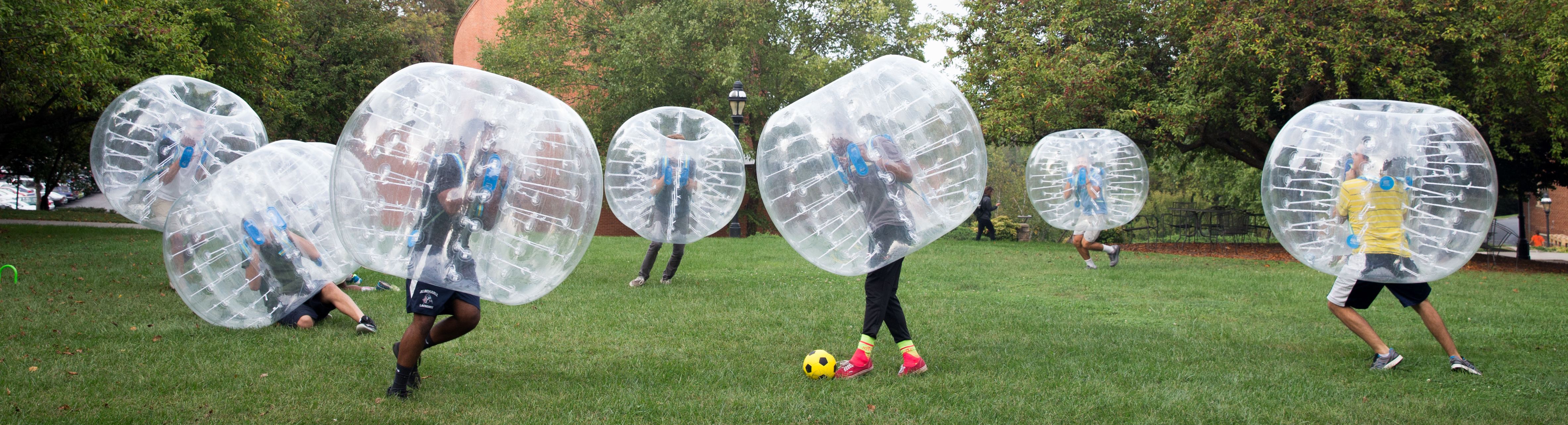 Students playing bubble soccer.